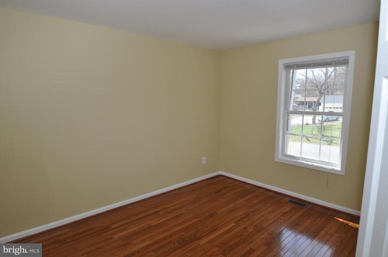 7401 Bull Run Road Manassas, VA 20111 - Photo 15 of 22 an empty room with wooden floor and windows