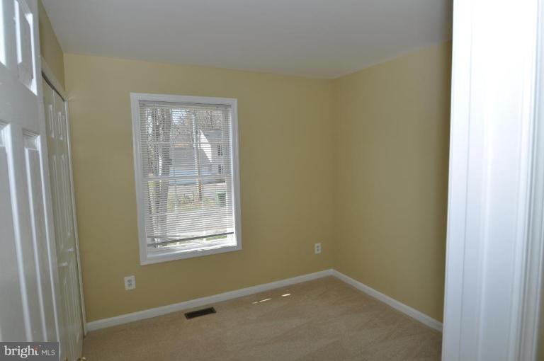 7401 Bull Run Road Manassas, VA 20111 - Photo 16 of 22 a view of a small space with wooden floor and windows in a room