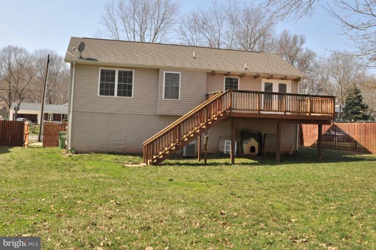 7401 Bull Run Road Manassas, VA 20111 - Photo 3 of 22 a view of a house with a yard and a wooden fence