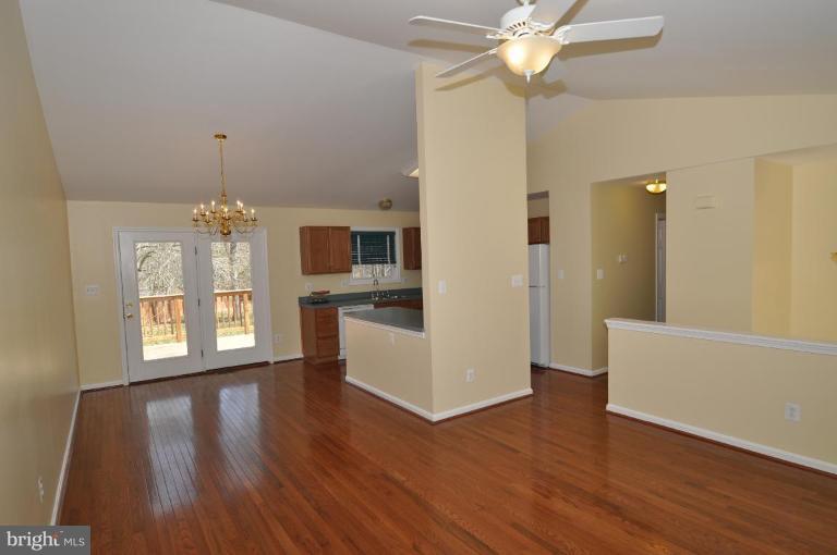 7401 Bull Run Road Manassas, VA 20111 - Photo 7 of 22 a view of an empty room with window and wooden floor