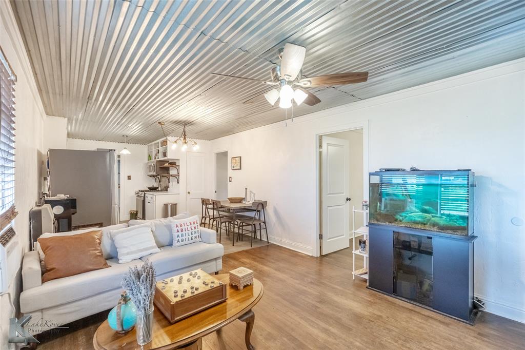 801 Highway 153 Wingate, TX 79566 - Photo 12 of 39 a living room with furniture and a wooden floor