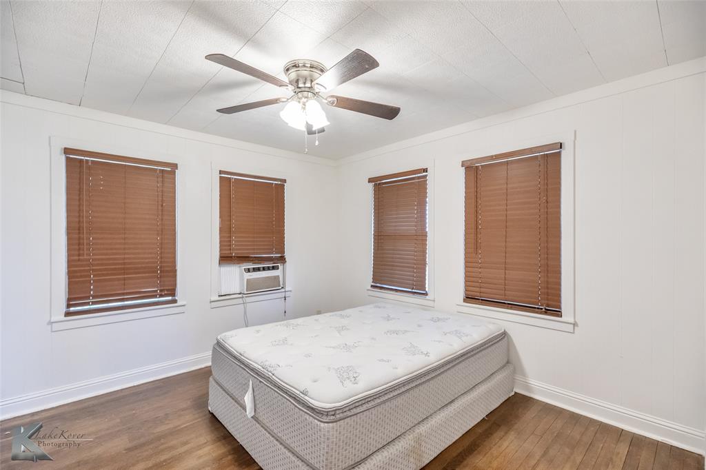 801 Highway 153 Wingate, TX 79566 - Photo 18 of 39 a bedroom with a large bed and a window