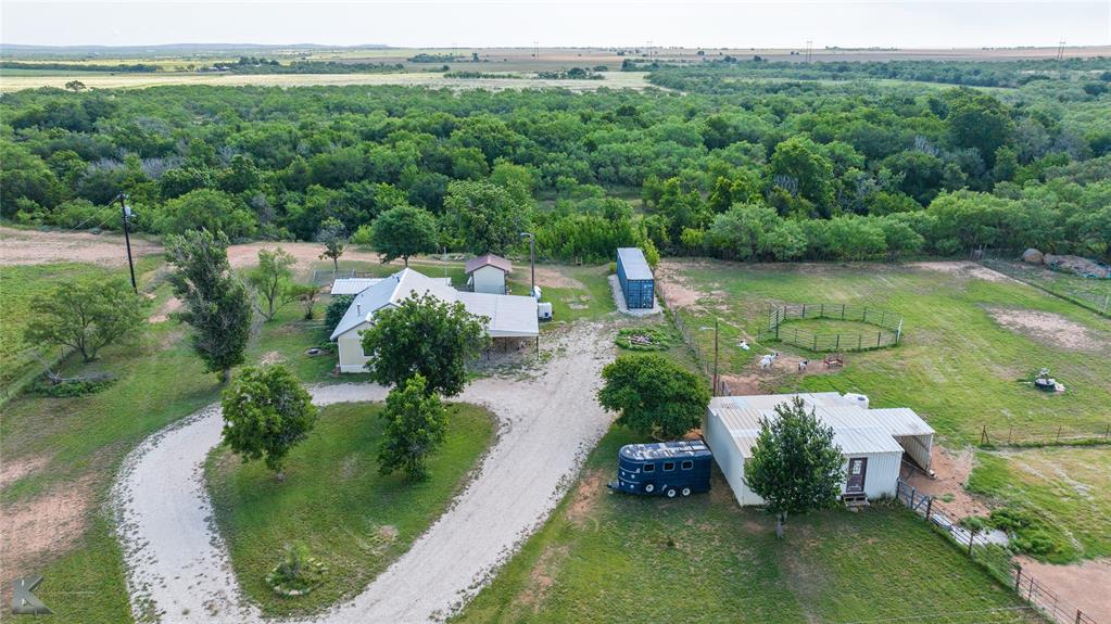 801 Highway 153 Wingate, TX 79566 - Photo 37 of 39 an aerial view of green landscape with trees houses and mountain view