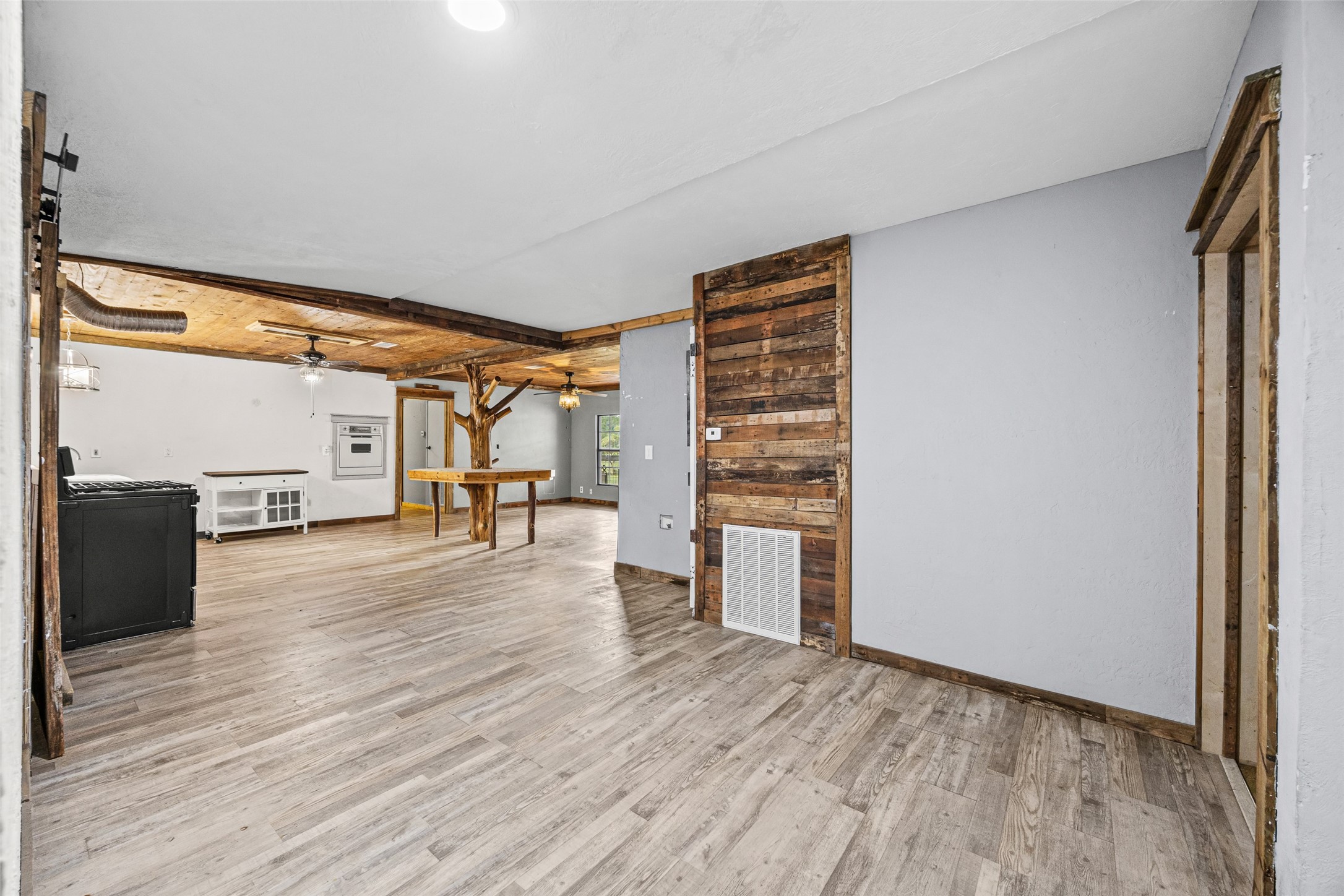 577 County Road 138 Jasper, TX 75951 - Photo 12 of 45 a view of empty room with wooden floor and fan