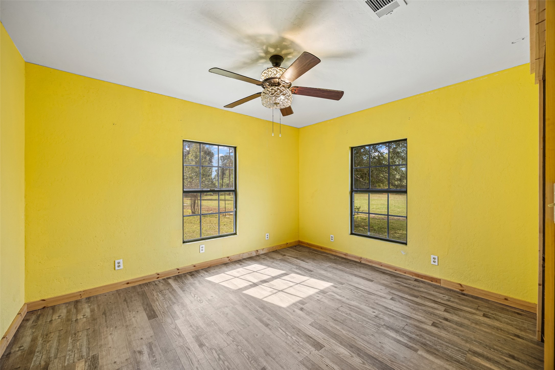 577 County Road 138 Jasper, TX 75951 - Photo 30 of 45 a view of empty room with wooden floor and fan