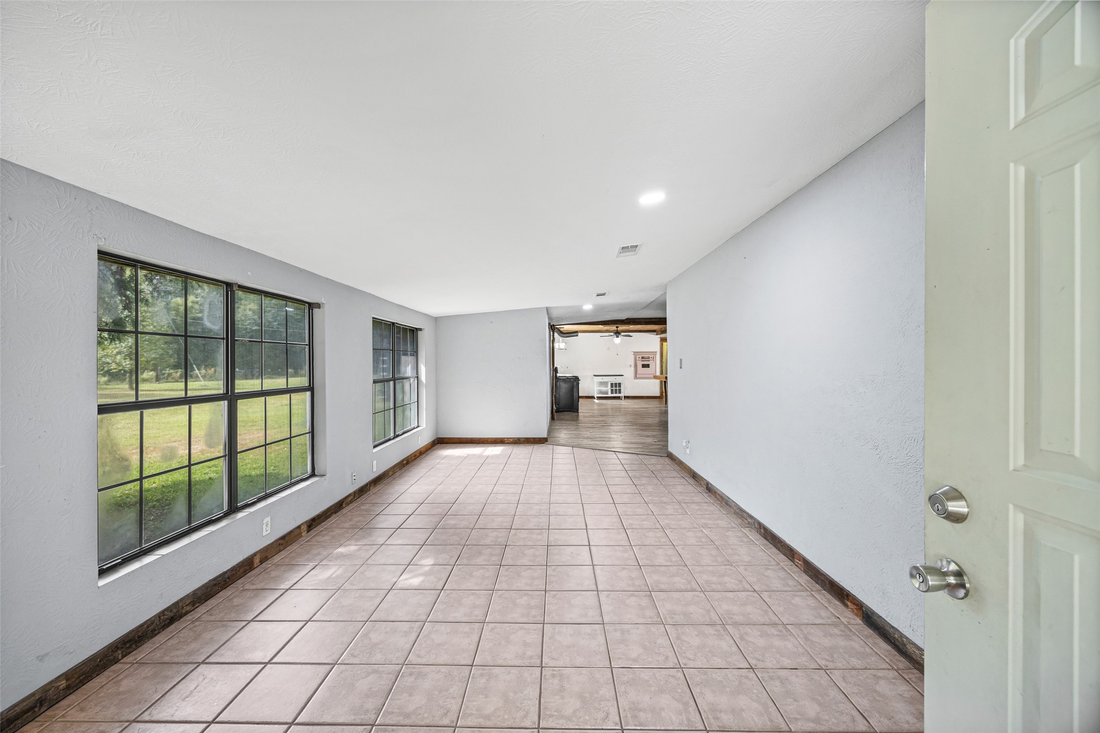 577 County Road 138 Jasper, TX 75951 - Photo 10 of 45 a view of empty room with wooden floor and fan