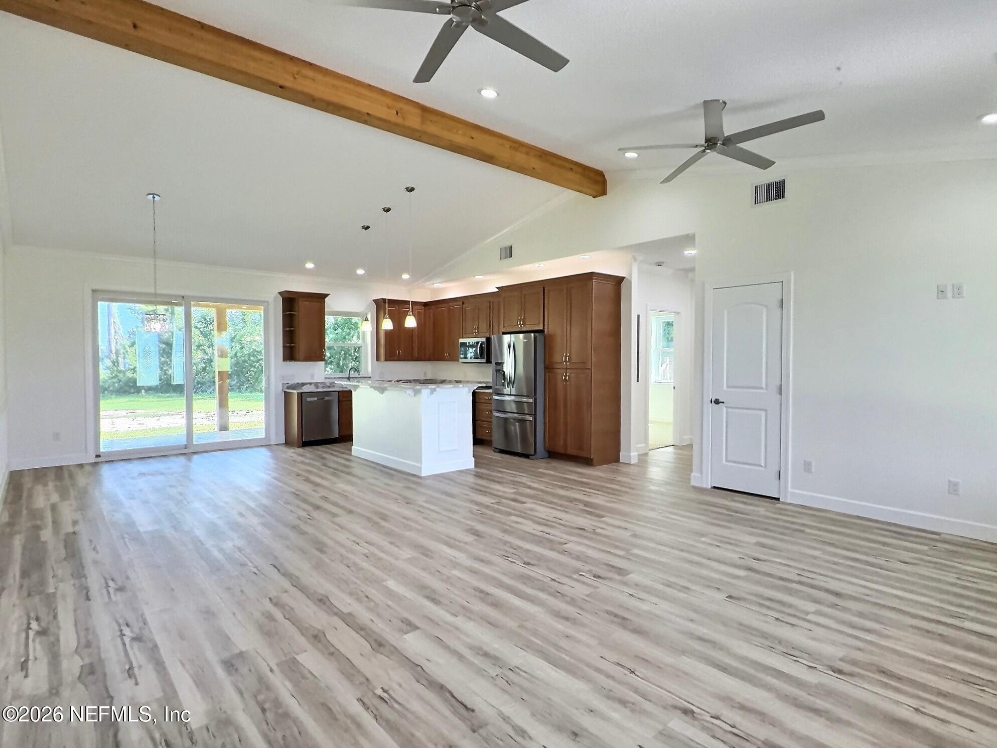 159 Mays Cove Road East Palatka, FL 32131 - Photo 61 of 62 a view of a electric appliances in kitchen and empty room with wooden floor