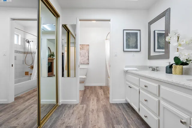 a bathroom with a double vanity sink and a mirror