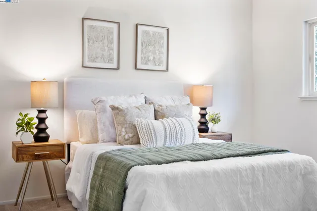 a bedroom with bed and window