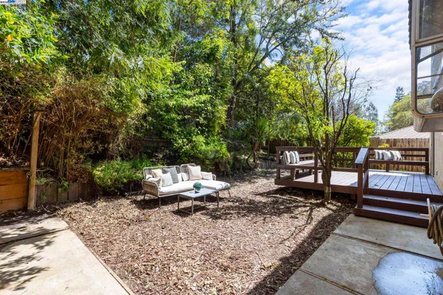 a view of a backyard with sitting area