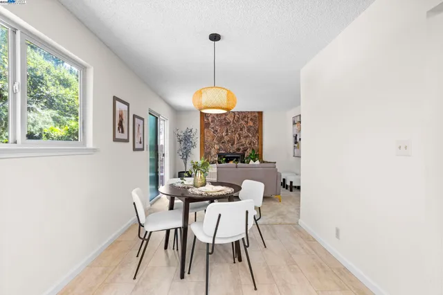 a dining room with furniture and window
