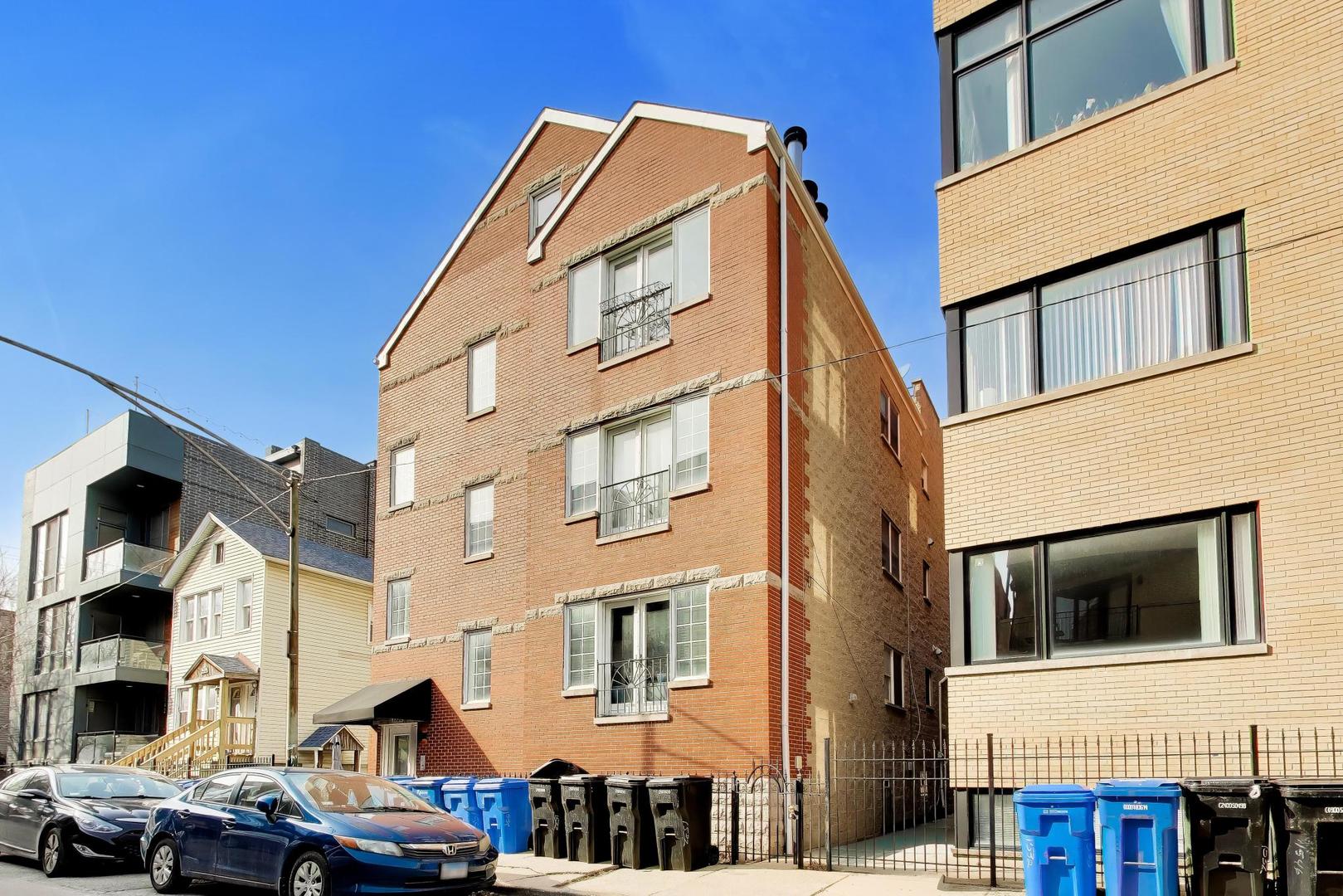 1532 West Fry Street, Unit 3 Chicago, IL 60642 - Photo 1 of 36 a view of a building with many windows