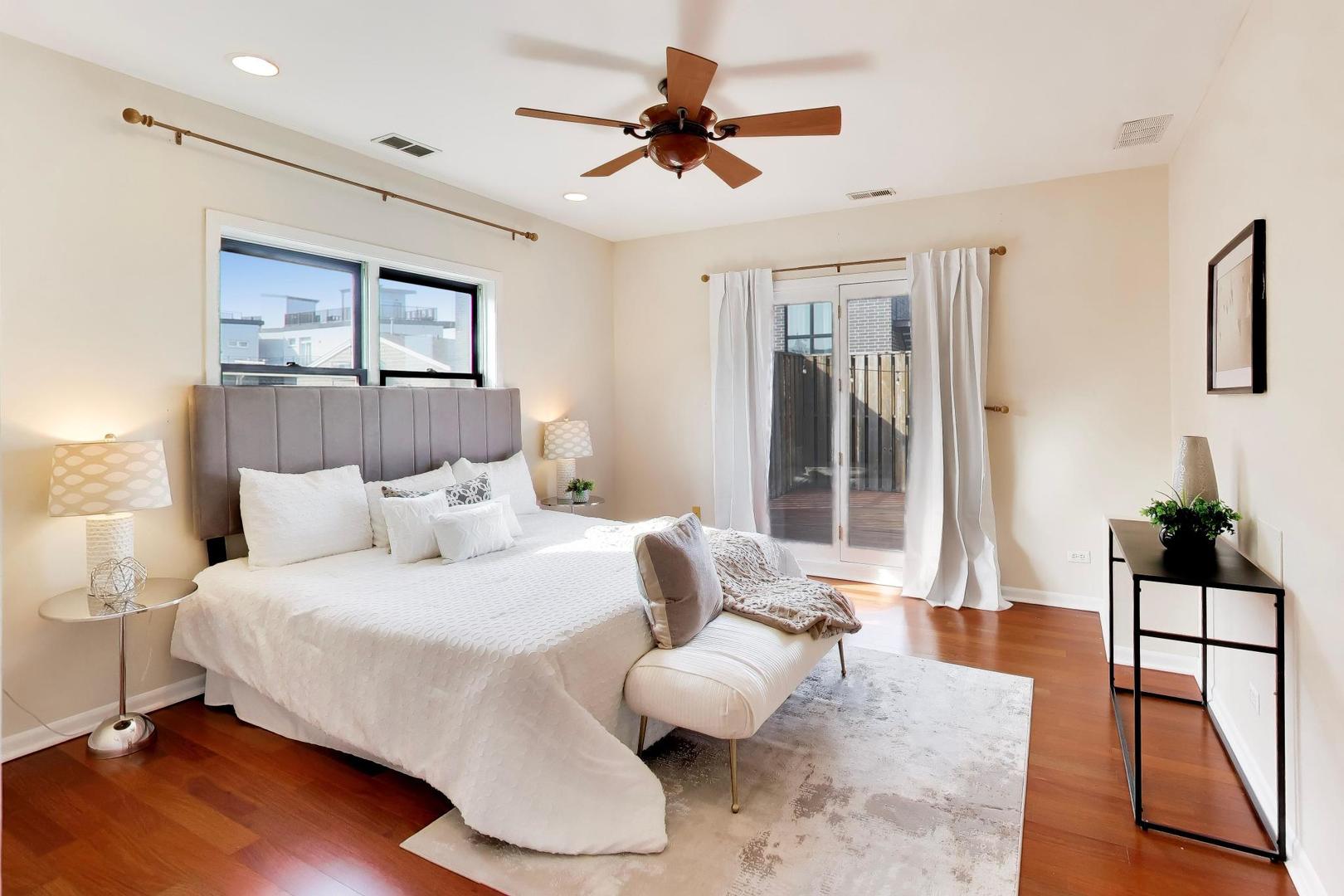 1532 West Fry Street, Unit 3 Chicago, IL 60642 - Photo 20 of 36 a bedroom with a bed and wooden floor