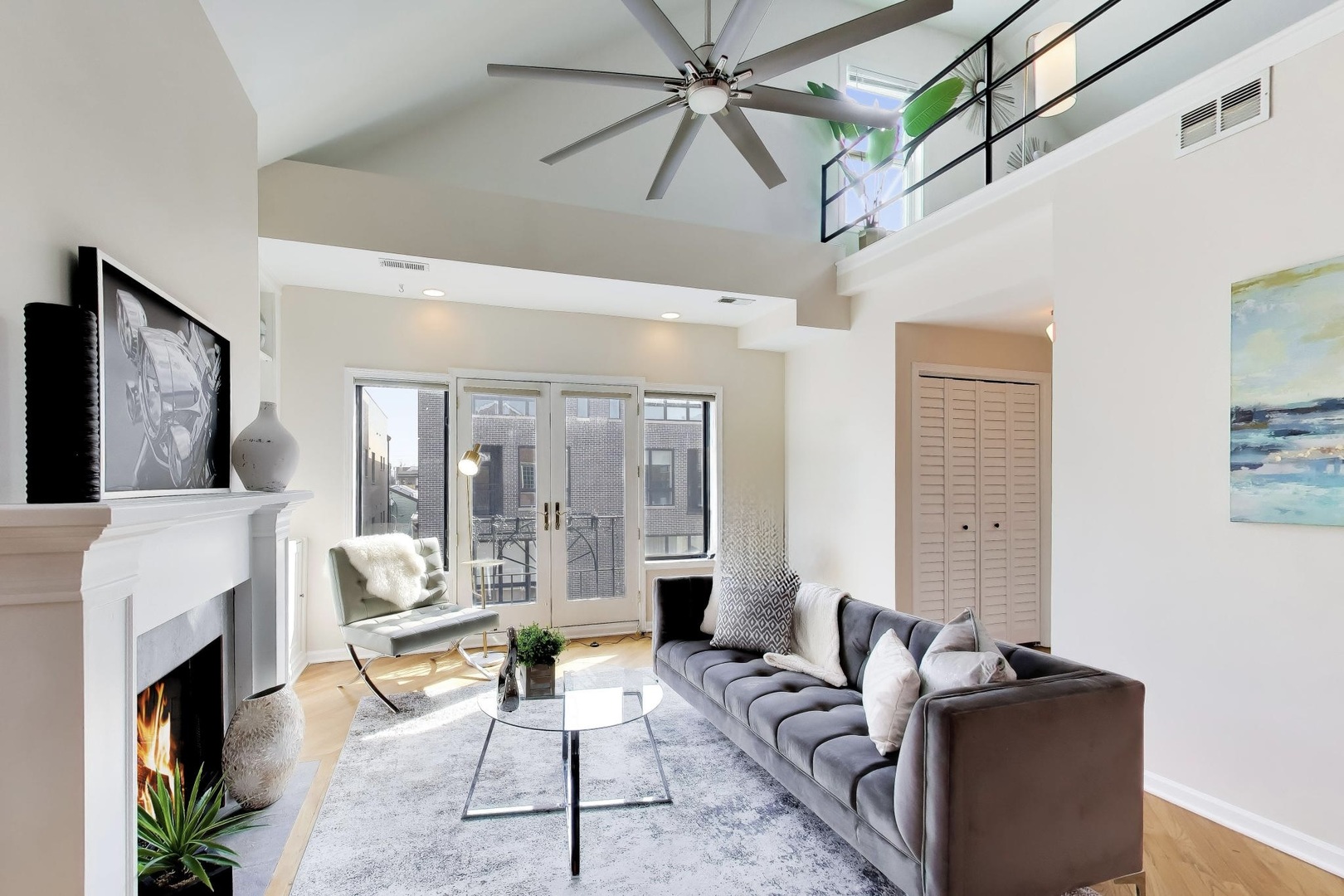1532 West Fry Street, Unit 3 Chicago, IL 60642 - Photo 2 of 36 a living room with furniture a flat screen tv and a fireplace