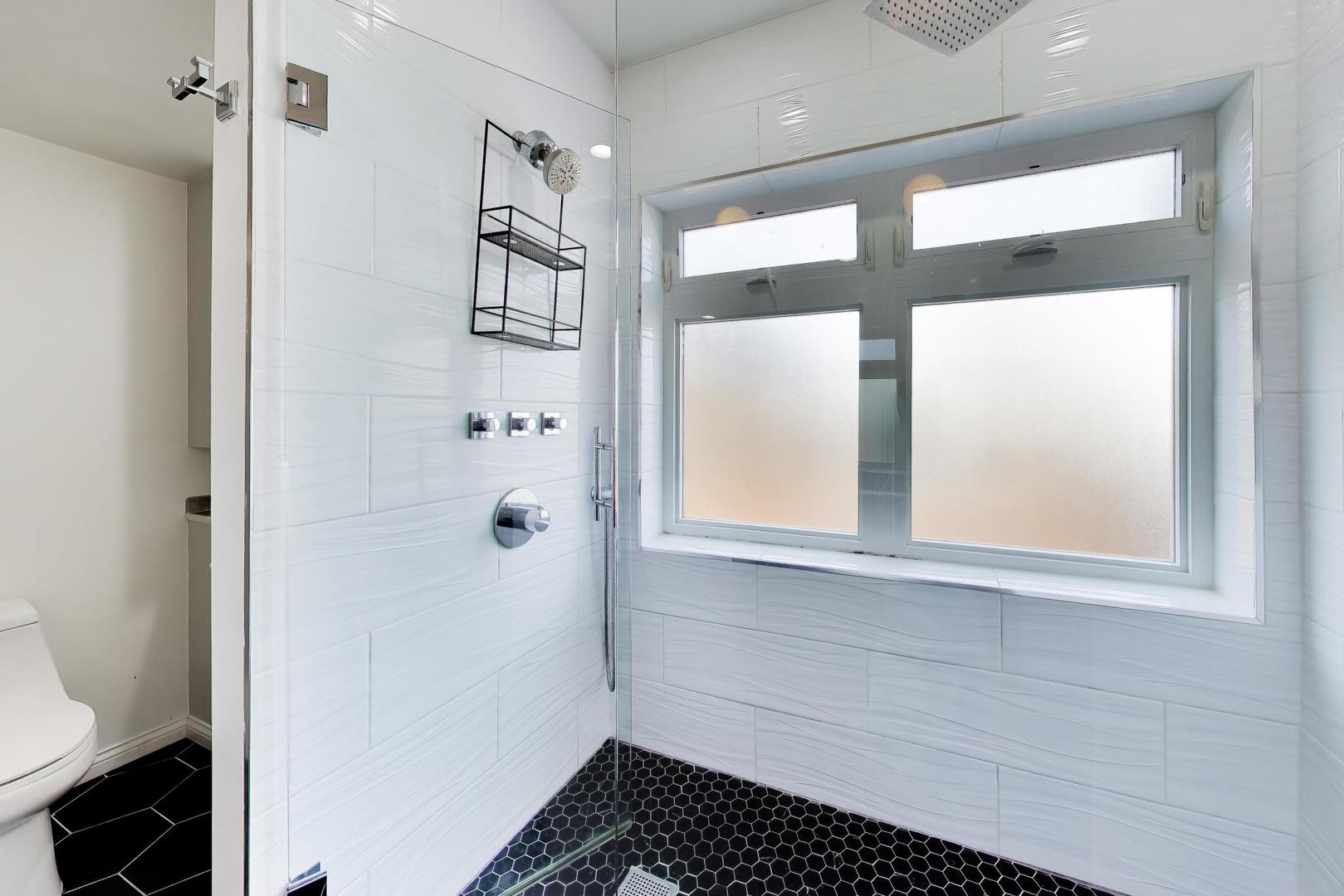 1532 West Fry Street, Unit 3 Chicago, IL 60642 - Photo 25 of 36 a bathroom with a bathtub and a shower