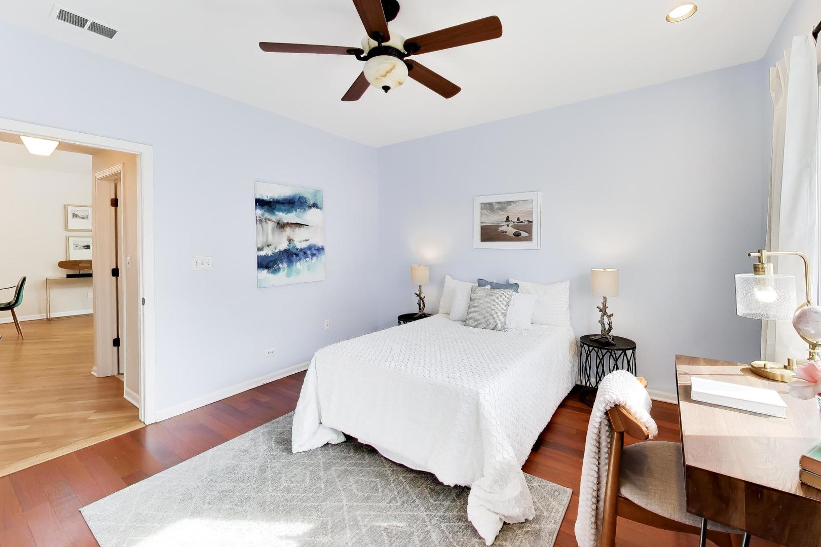 1532 West Fry Street, Unit 3 Chicago, IL 60642 - Photo 27 of 36 a bedroom with a bed and wooden floor