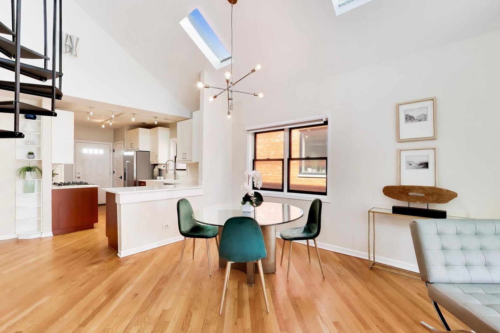 1532 West Fry Street, Unit 3 Chicago, IL 60642 - Photo 5 of 36 a view of a dining room with furniture and wooden floor