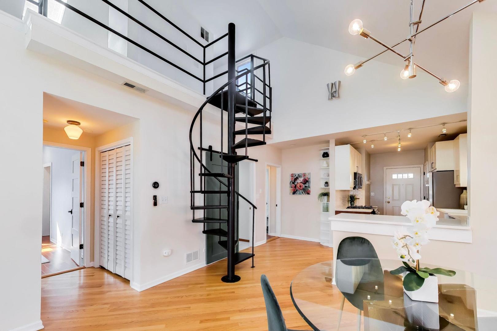 1532 West Fry Street, Unit 3 Chicago, IL 60642 - Photo 7 of 36 a view of a livingroom with furniture and staircase
