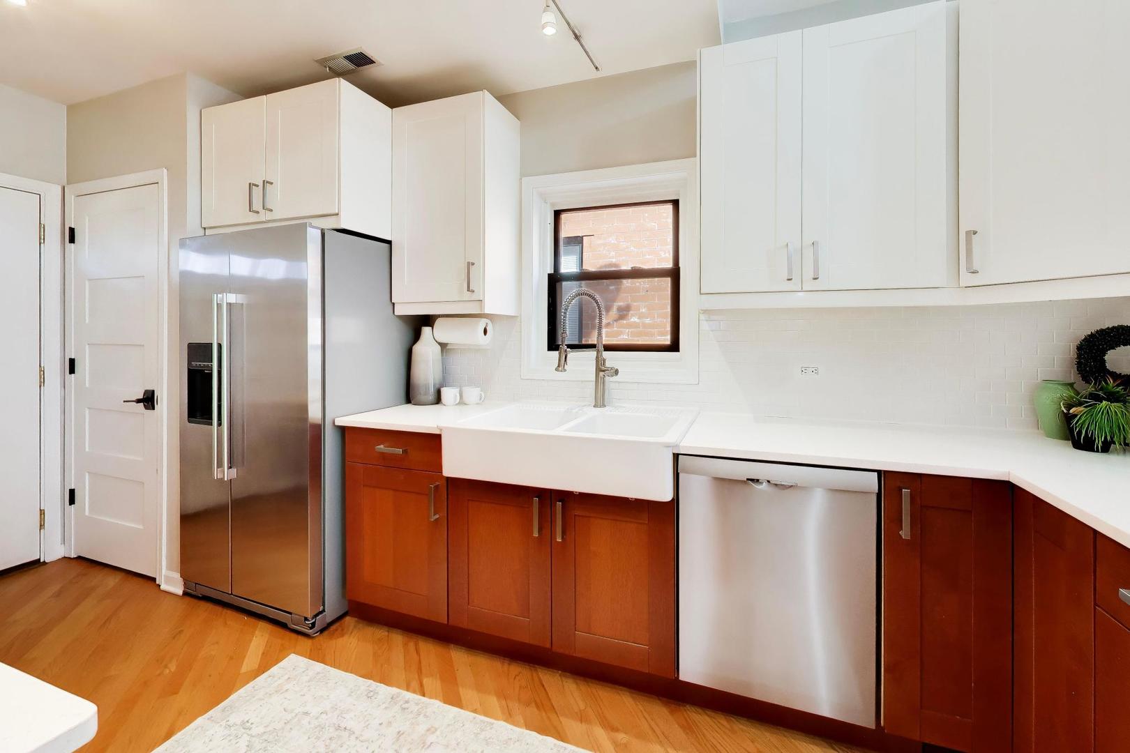 1532 West Fry Street, Unit 3 Chicago, IL 60642 - Photo 10 of 36 a kitchen with stainless steel appliances a sink cabinets and a counter top space
