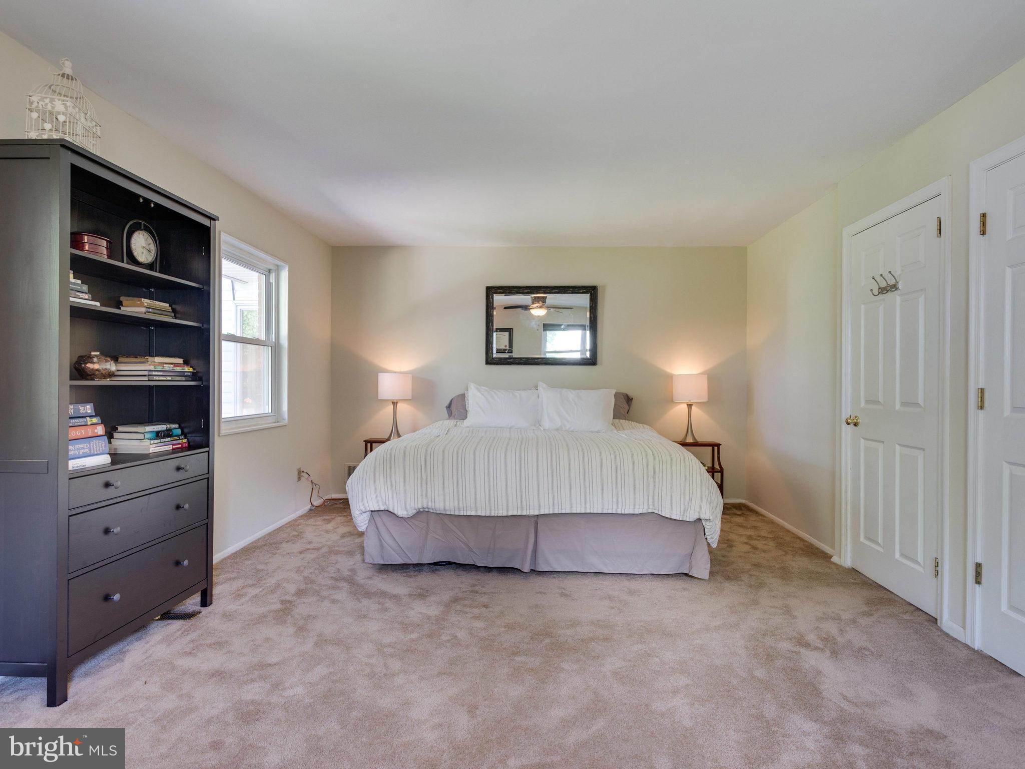 5402 Ives Place Springfield, VA 22151 - Photo 22 of 30 a spacious bedroom with a bed and a window