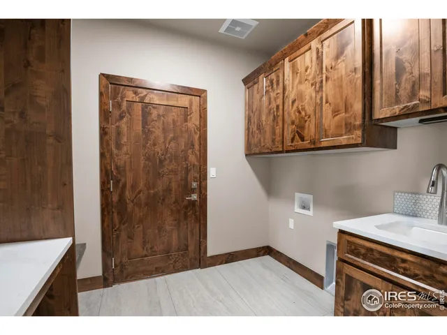 a kitchen with stainless steel appliances a stove a sink and a microwave