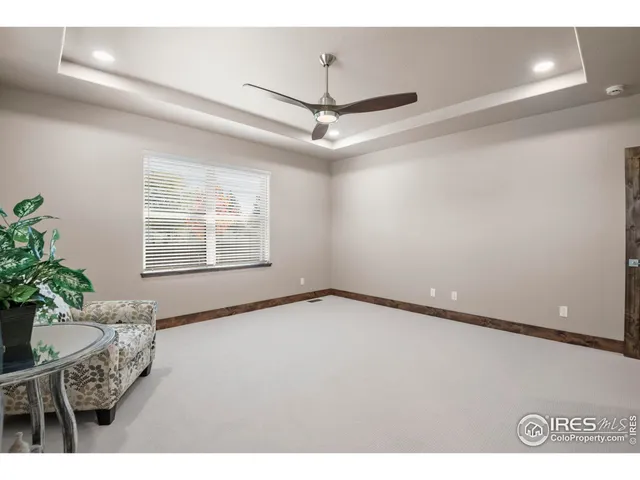 a front view of a house with a garden and yard