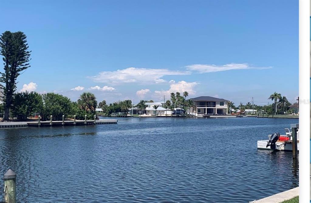 526 67th Street Holmes Beach, FL 34217 - Photo 3 of 6 a view of a lake