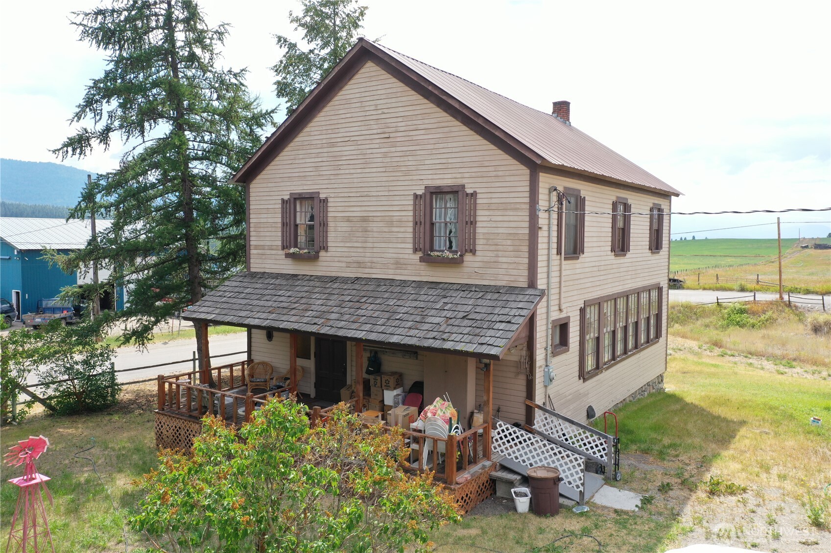 7 Lost Lake Road Oroville, WA 98844 - Photo 1 of 31 a view of a house with backyard and sitting area