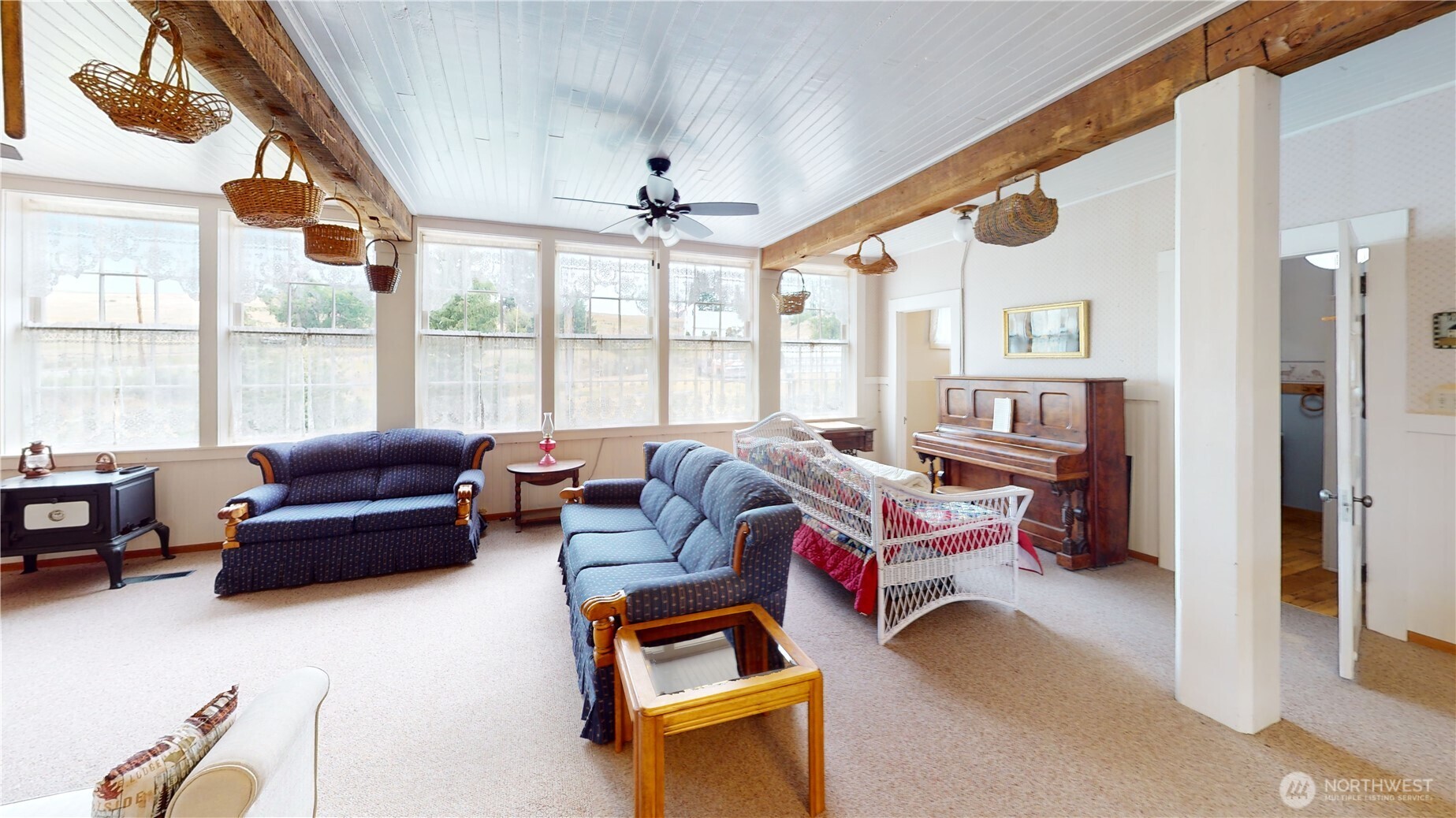 7 Lost Lake Road Oroville, WA 98844 - Photo 13 of 31 a living room with furniture a flat screen tv and a large window