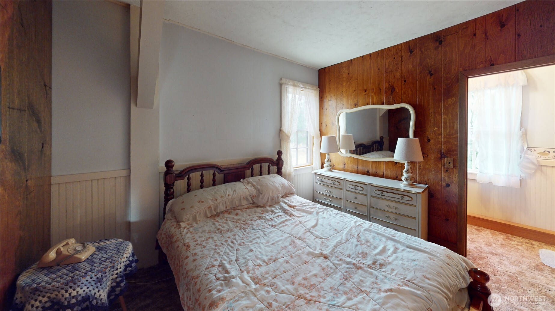 7 Lost Lake Road Oroville, WA 98844 - Photo 17 of 31 a bedroom with a bed and wooden floor