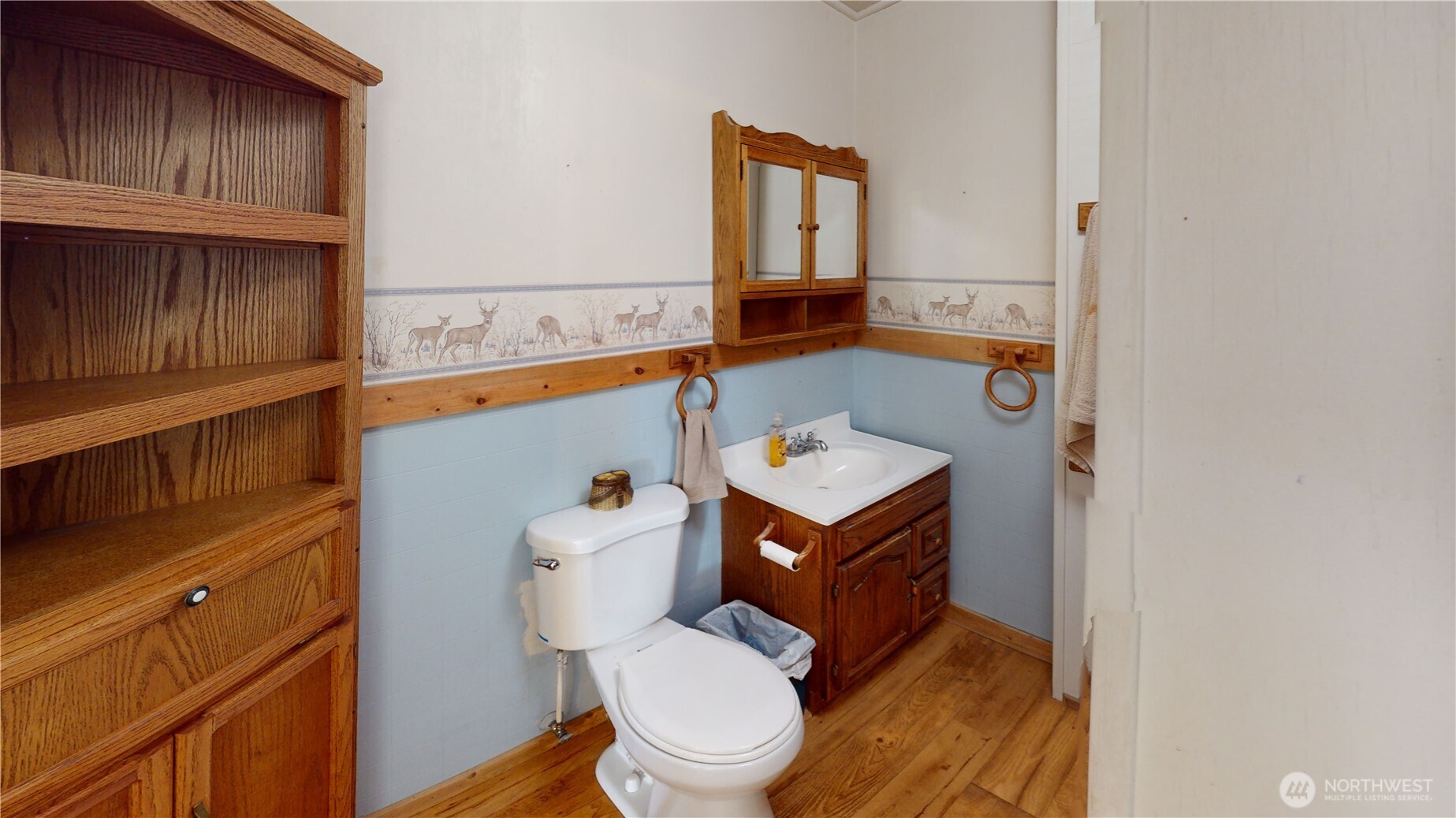 7 Lost Lake Road Oroville, WA 98844 - Photo 18 of 31 a bathroom with a toilet a sink and mirror