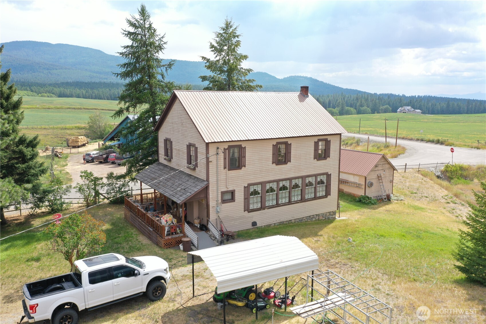 7 Lost Lake Road Oroville, WA 98844 - Photo 2 of 31 a view of a couches and a table in the balcony