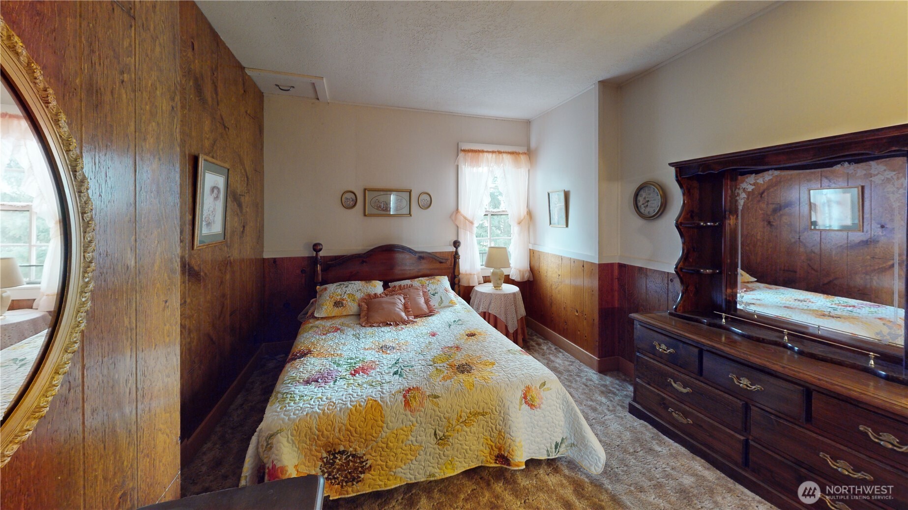 7 Lost Lake Road Oroville, WA 98844 - Photo 22 of 31 a bedroom with a bed and a flat tv screen on dresser