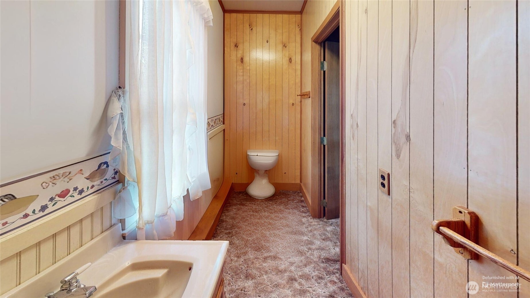 7 Lost Lake Road Oroville, WA 98844 - Photo 23 of 31 a view of a hallway with bathroom and wooden floor