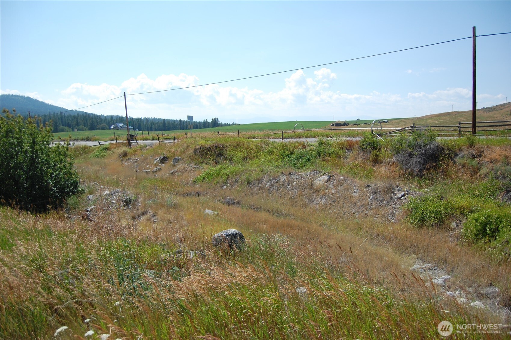 7 Lost Lake Road Oroville, WA 98844 - Photo 27 of 31 a view of a lake with a big yard
