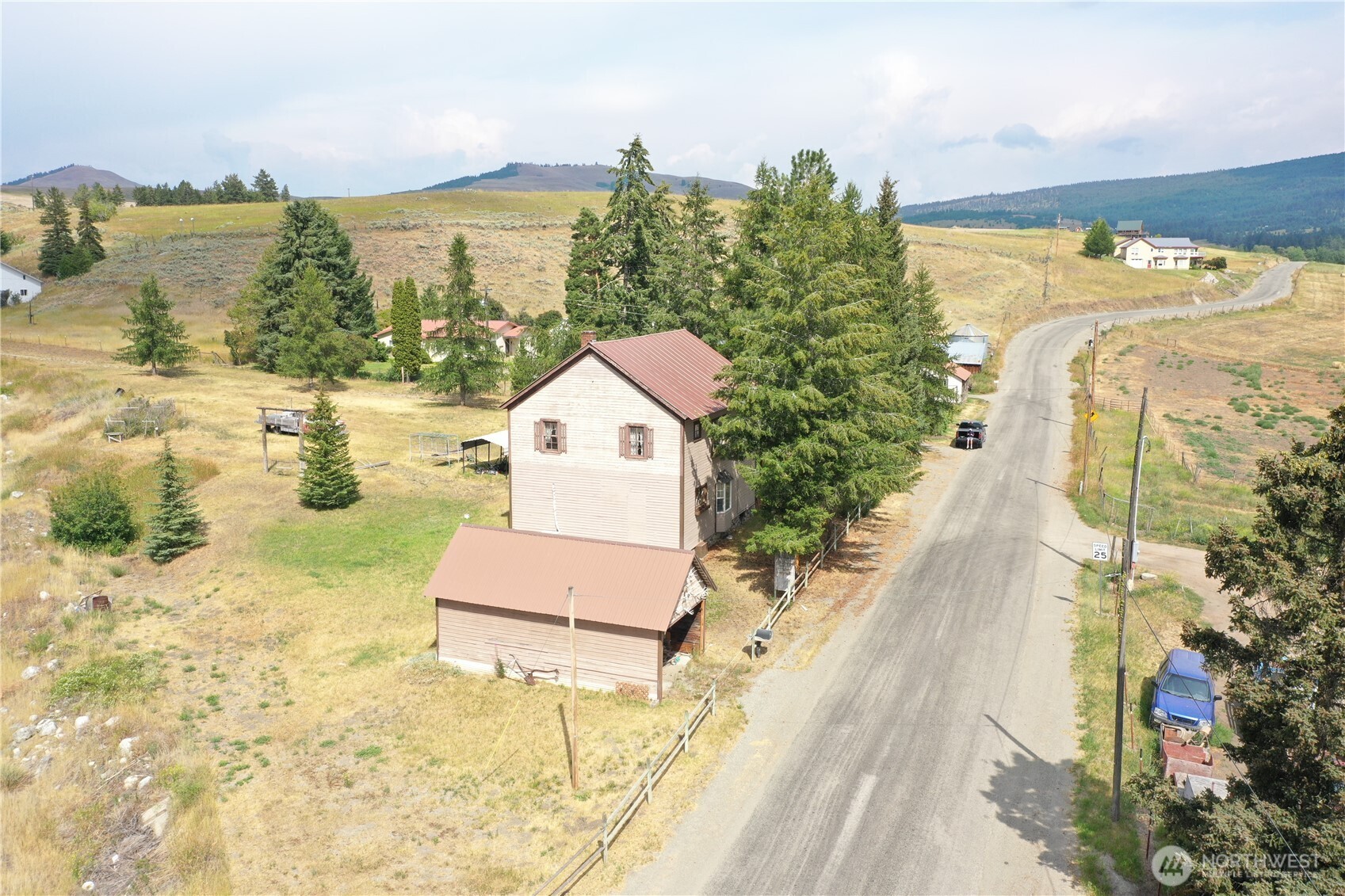 7 Lost Lake Road Oroville, WA 98844 - Photo 4 of 31 a view of a walk in the water with a building in the background