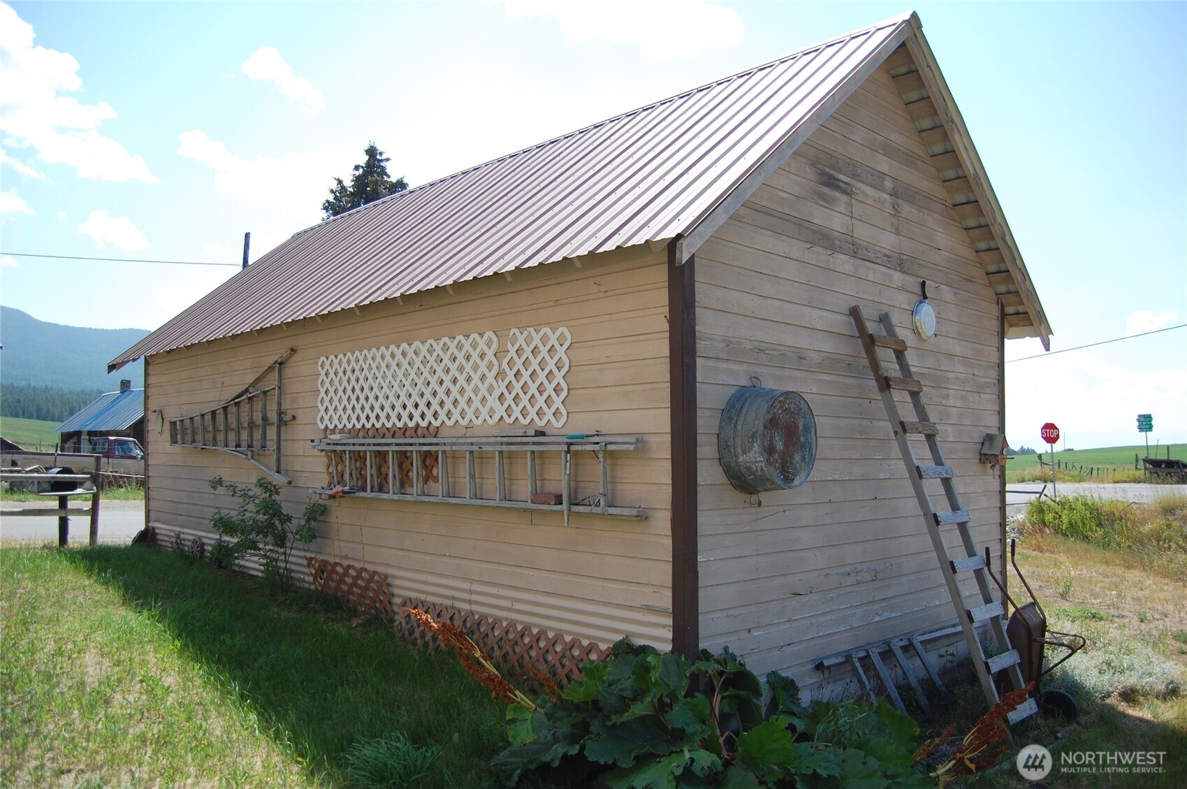 7 Lost Lake Road Oroville, WA 98844 - Photo 9 of 31 a front view of a house with a garden