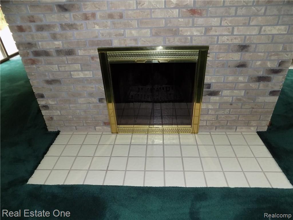 4650 Clyde Road Holly, MI 48442 - Photo 27 of 68 Living room fireplace