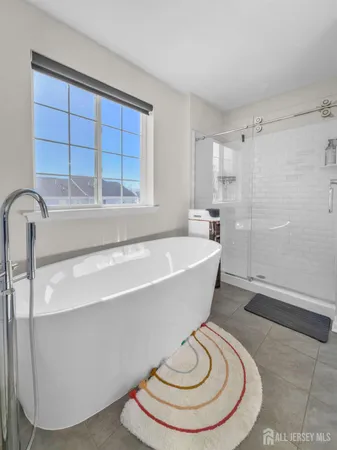 a white bath tub sitting in a bathroom