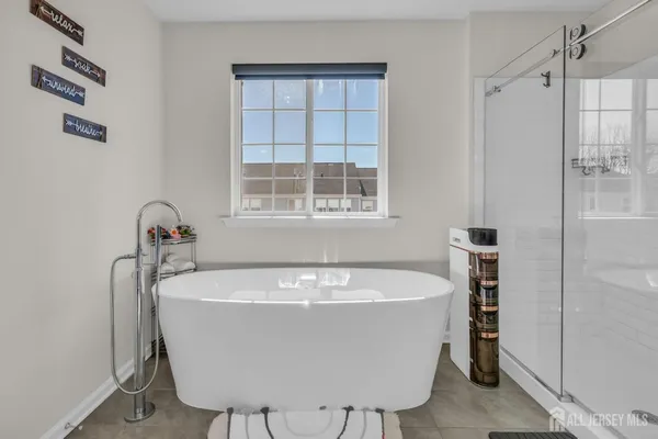 a white bath tub sitting in a bathroom