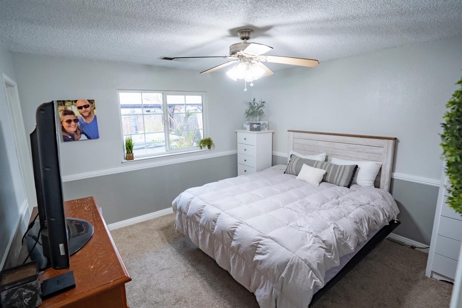 1607 Ashlan Avenue Clovis, CA 93611 - Photo 13 of 17 a bedroom with bed and window