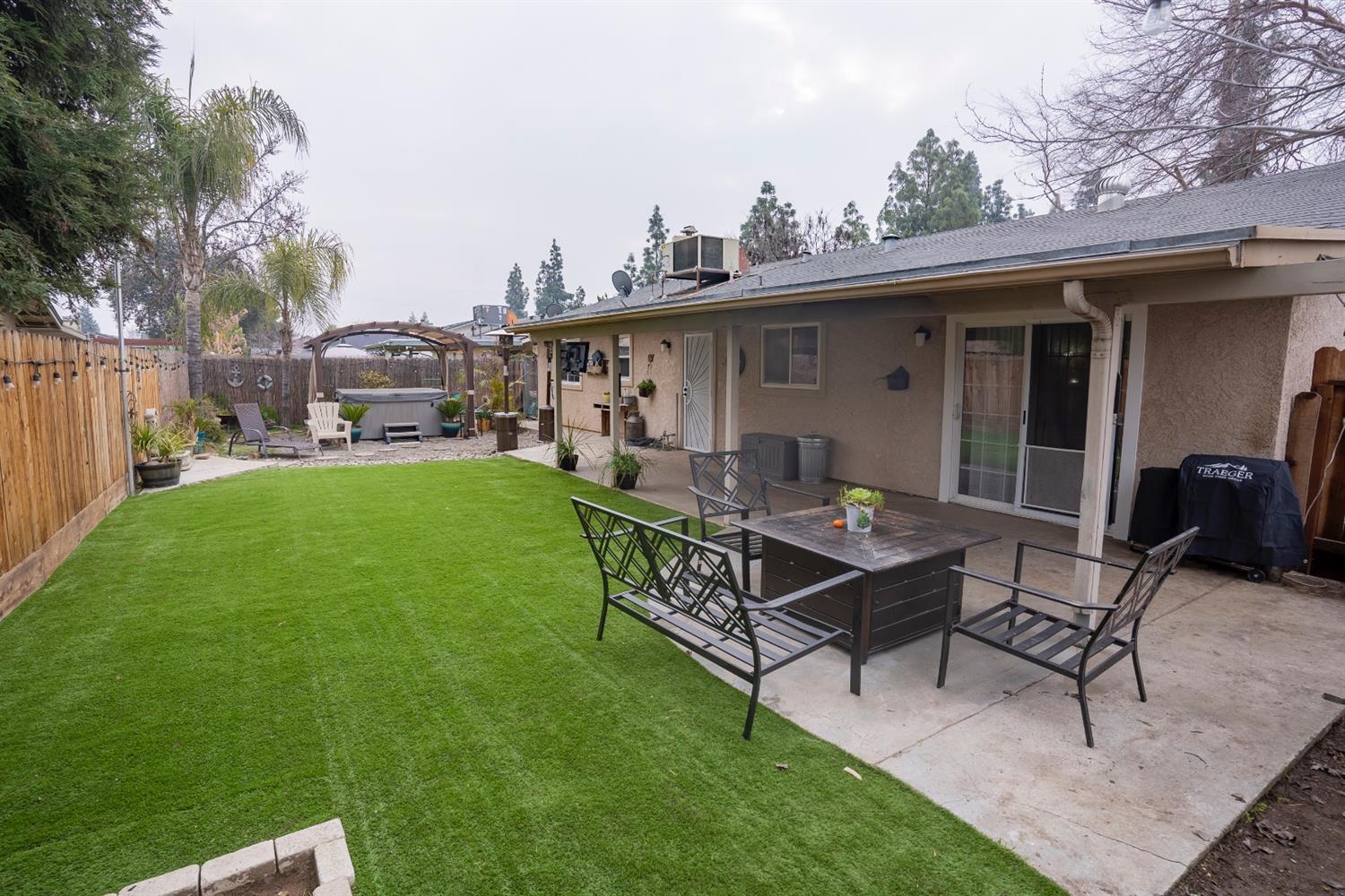 1607 Ashlan Avenue Clovis, CA 93611 - Photo 17 of 17 a backyard of a house with table and chairs
