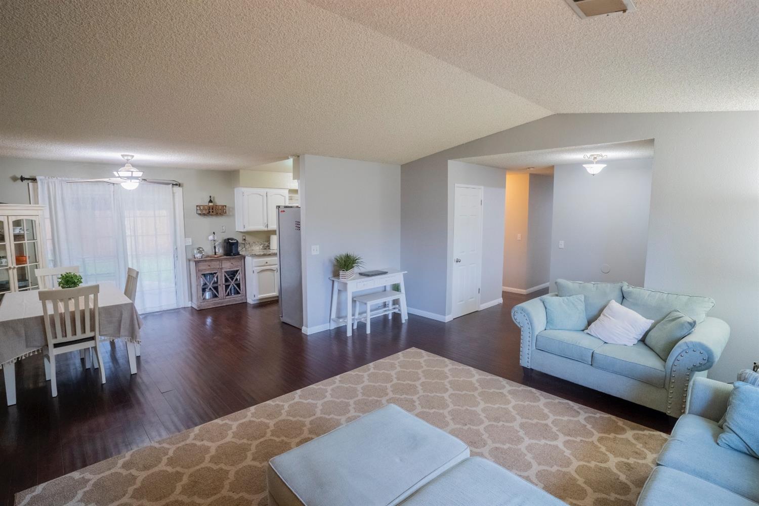 1607 Ashlan Avenue Clovis, CA 93611 - Photo 6 of 17 a living room with furniture and a wooden floor