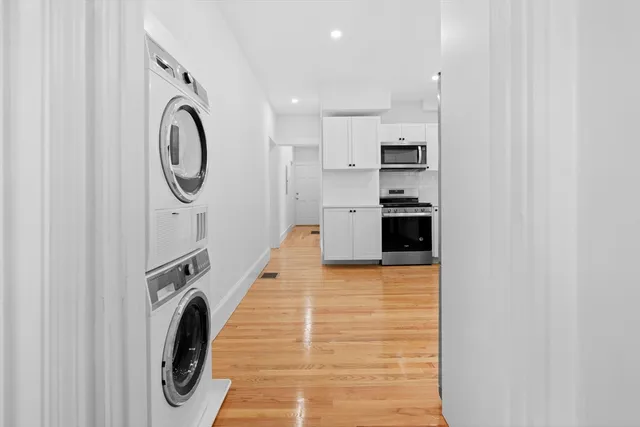 a hallway with washer and dryer