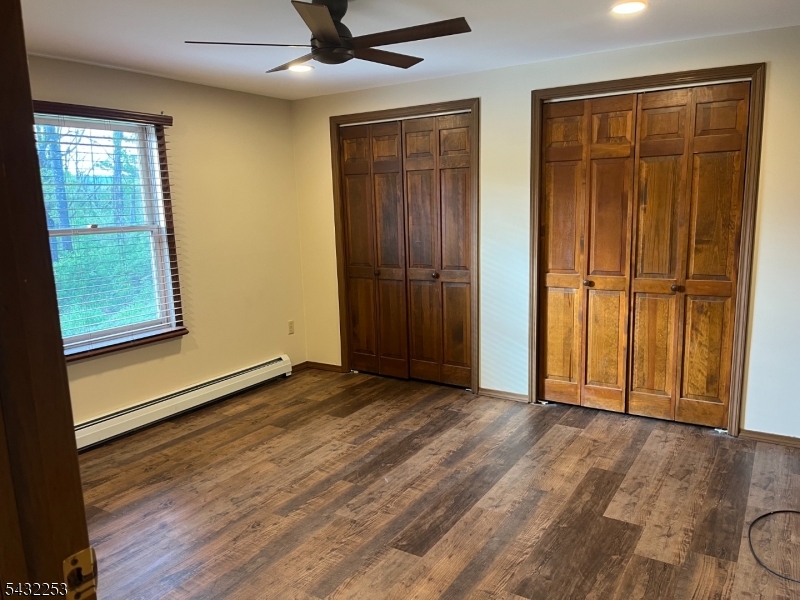 31 Countryside Road Columbia, NJ 07832 - Photo 7 of 31 an empty room with wooden floor closet and windows