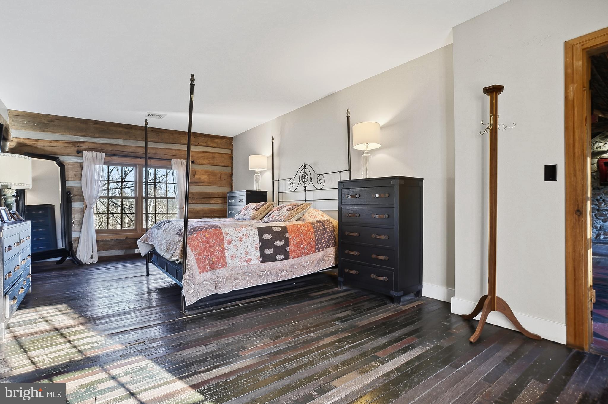 201 Pine Swamp Road Elverson, PA 19520 - Photo 25 of 60 a bedroom with bed and wooden floor