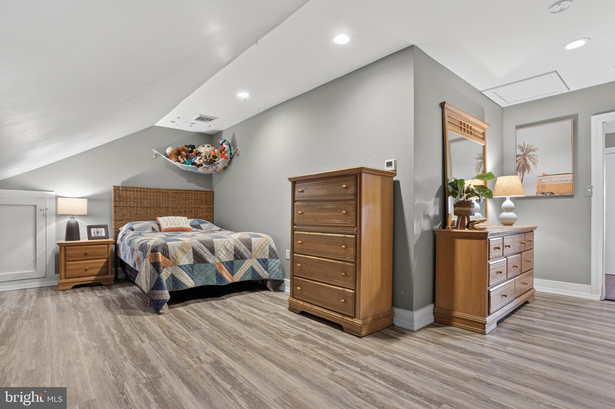 201 Pine Swamp Road Elverson, PA 19520 - Photo 30 of 60 a bedroom with a bed and wooden floor