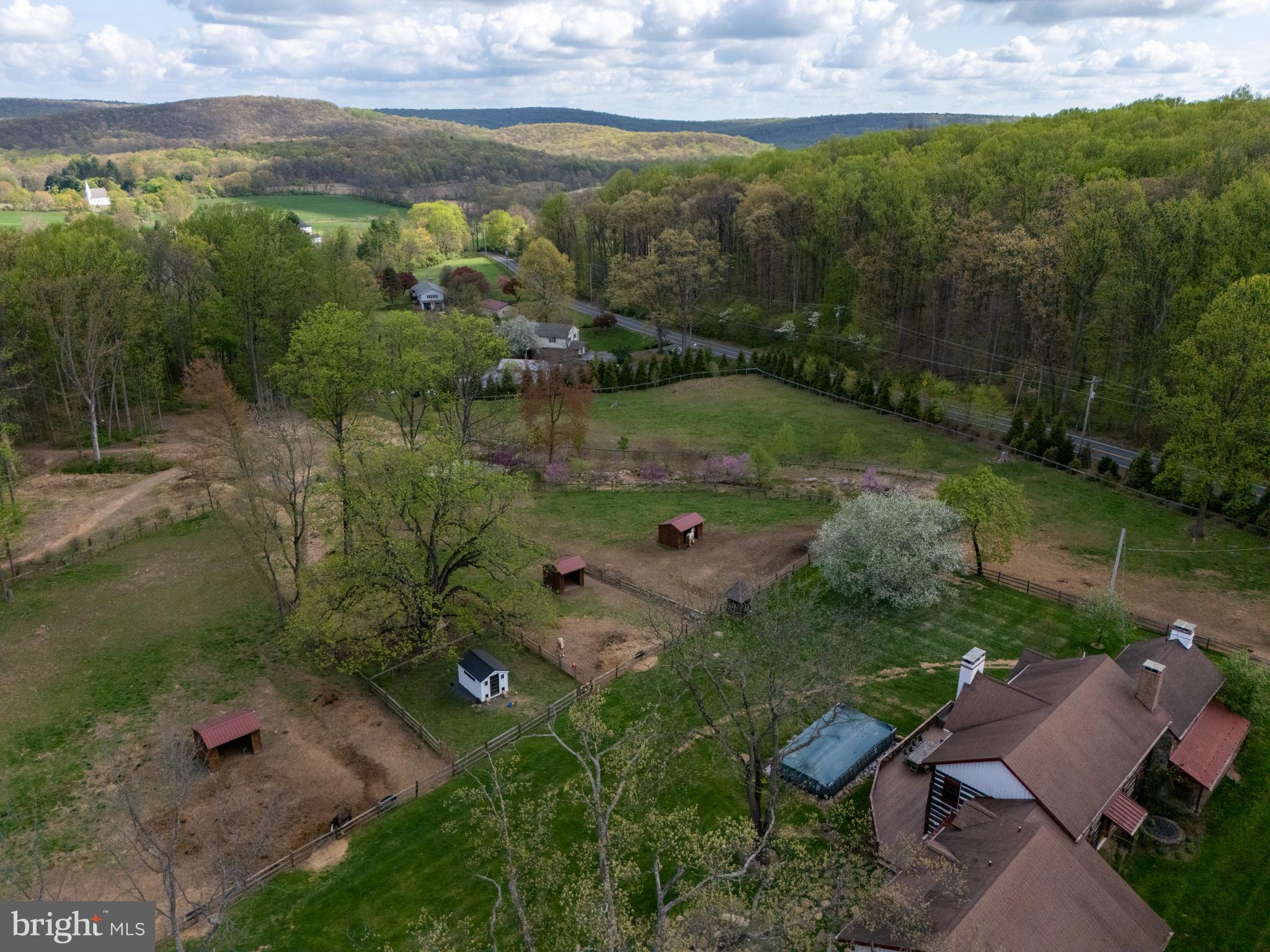 201 Pine Swamp Road Elverson, PA 19520 - Photo 3 of 60 a view of a lake with a yard