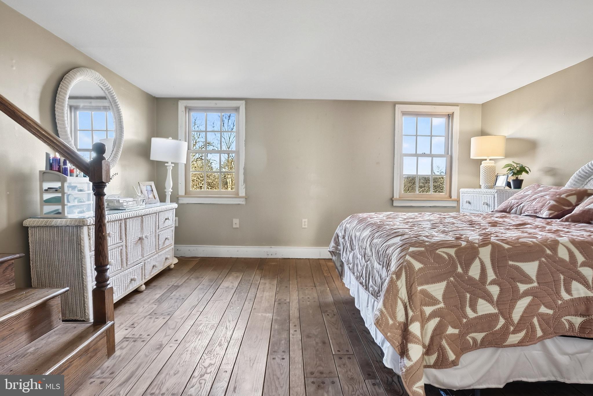 201 Pine Swamp Road Elverson, PA 19520 - Photo 32 of 60 a bedroom with a bed and a large window