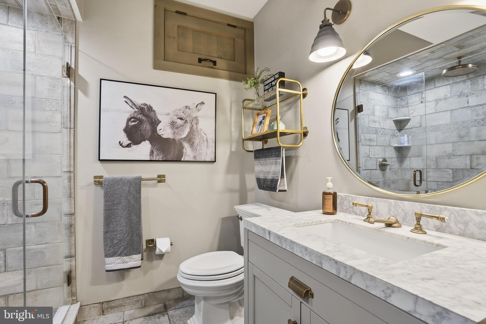 201 Pine Swamp Road Elverson, PA 19520 - Photo 40 of 60 a bathroom with a granite countertop sink toilet and shower